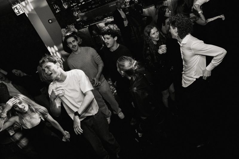 Black and white: friends singing and dancing on the dancefloor