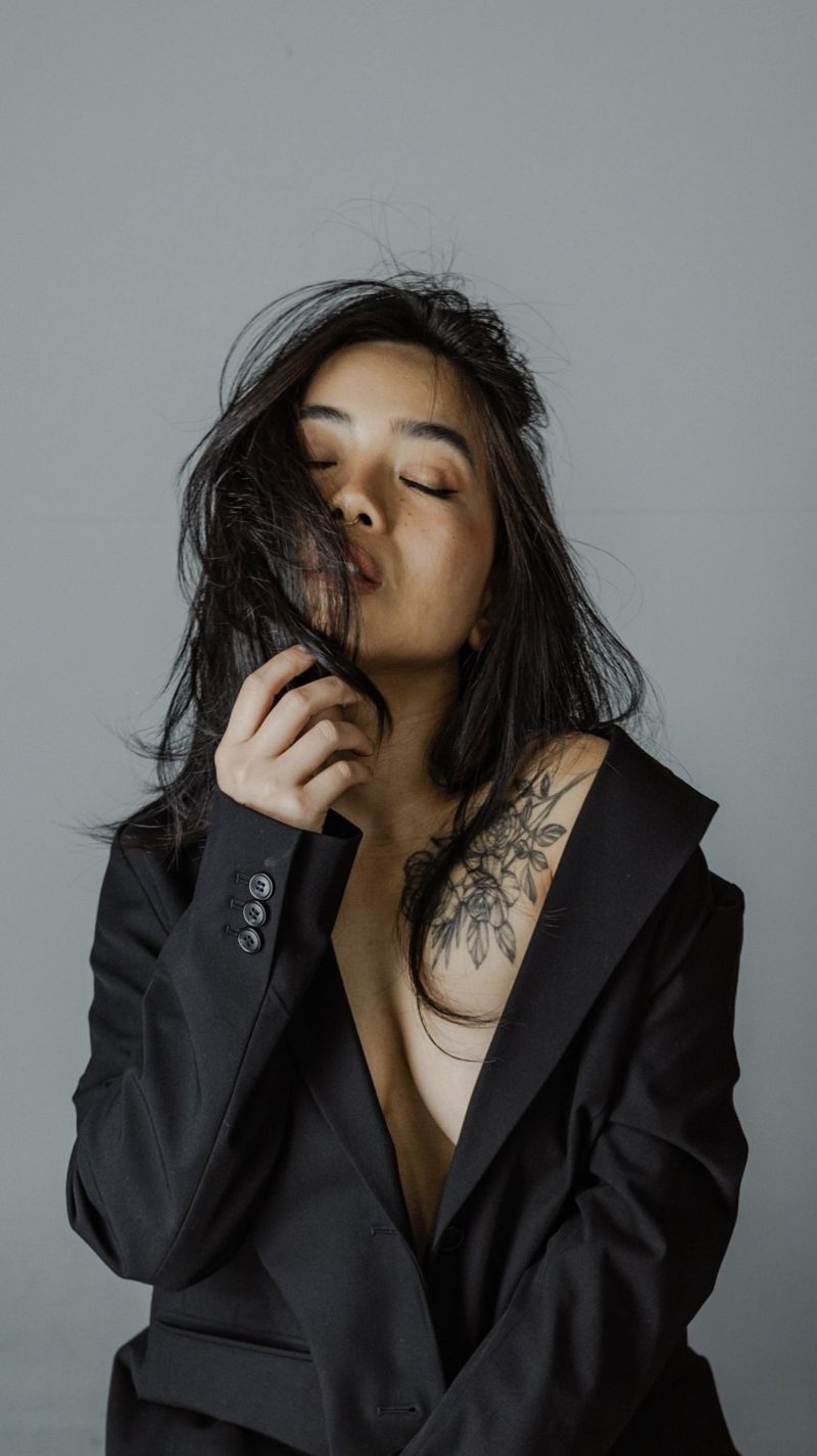 Portrait with eyes closed in a black blazer