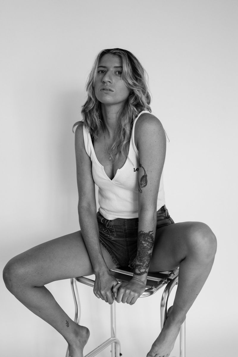 Black and white portrait on a bar stool