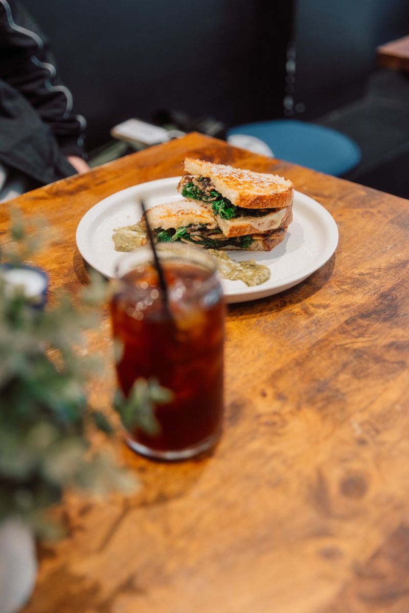 Mushroom and kale toastie with an iced long black